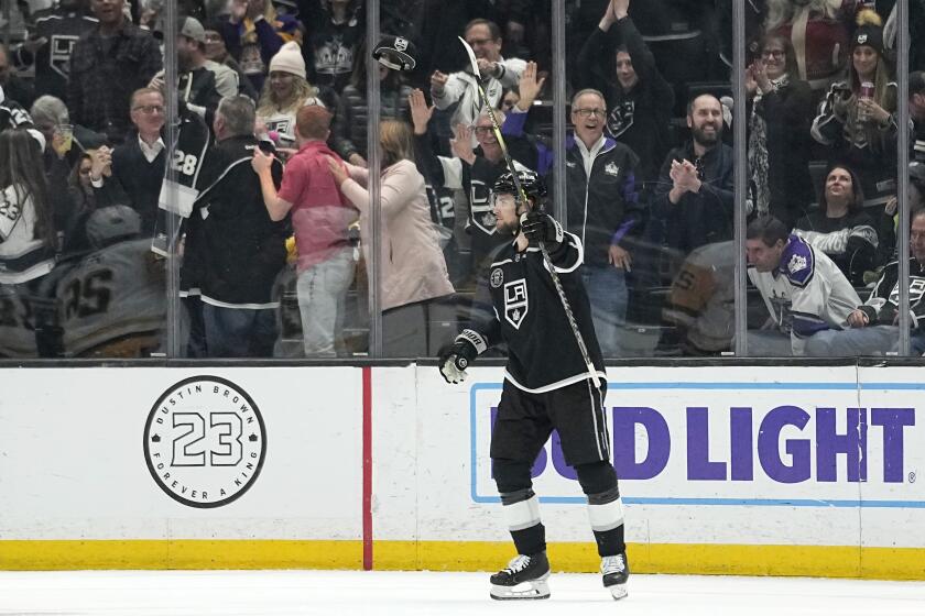 The Kings' Adrian Kempe celebrates his fourth goal during a rout of the Pittsburgh Penguins on Feb. 11, 2023.