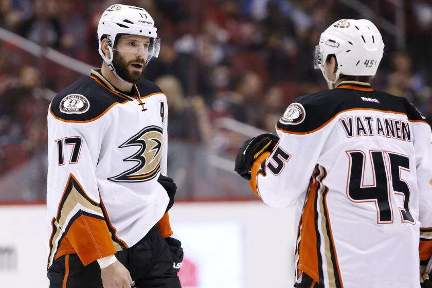 The Ducks' Ryan Kesler, left, talks with Sami Vatanen during a game against the Arizona Coyotes on March 3.