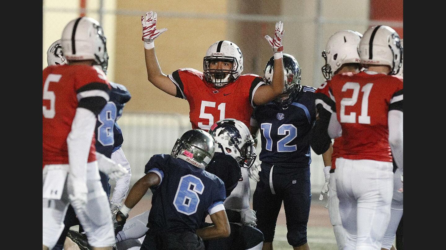 Photo Gallery: Crescenta Valley vs. Glendale in Pacific League football and the Crescenta Valley marching band takes the field in Halloween costumes