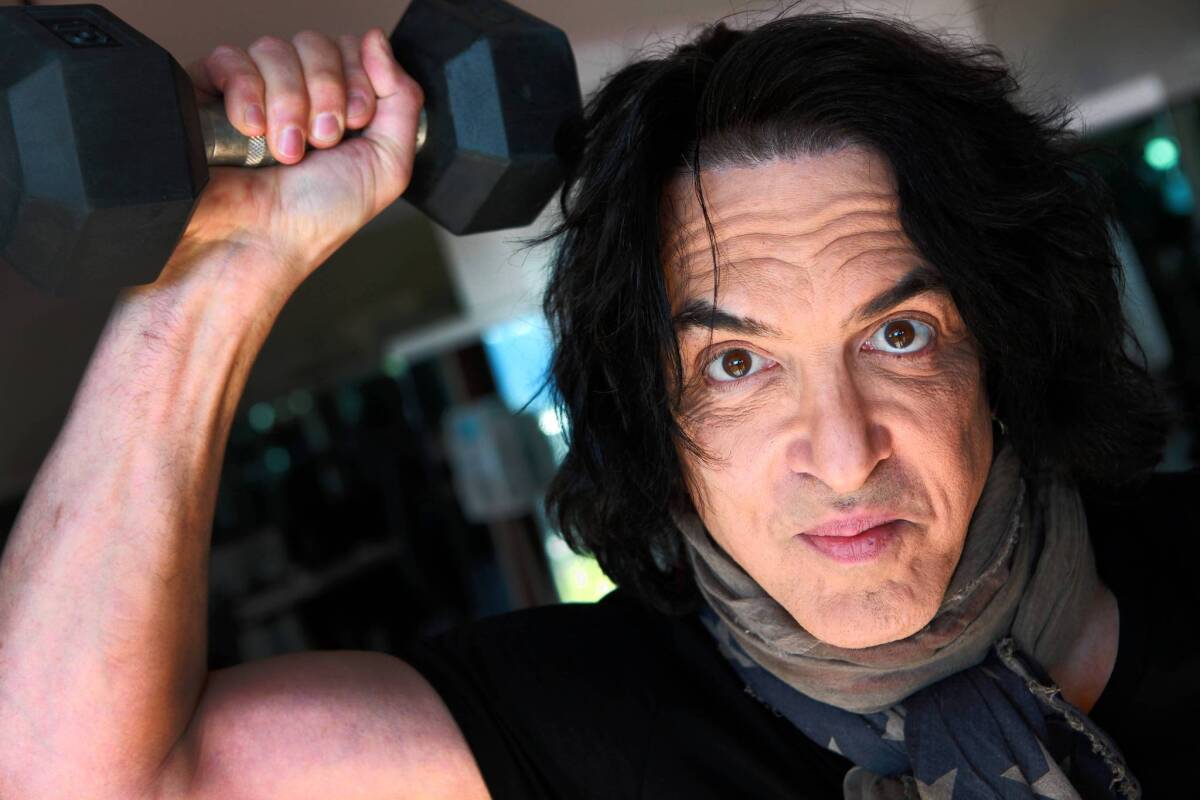 Paul Stanley of KISS, in his home gym, calls his workout "sport-specific training" for his tours.