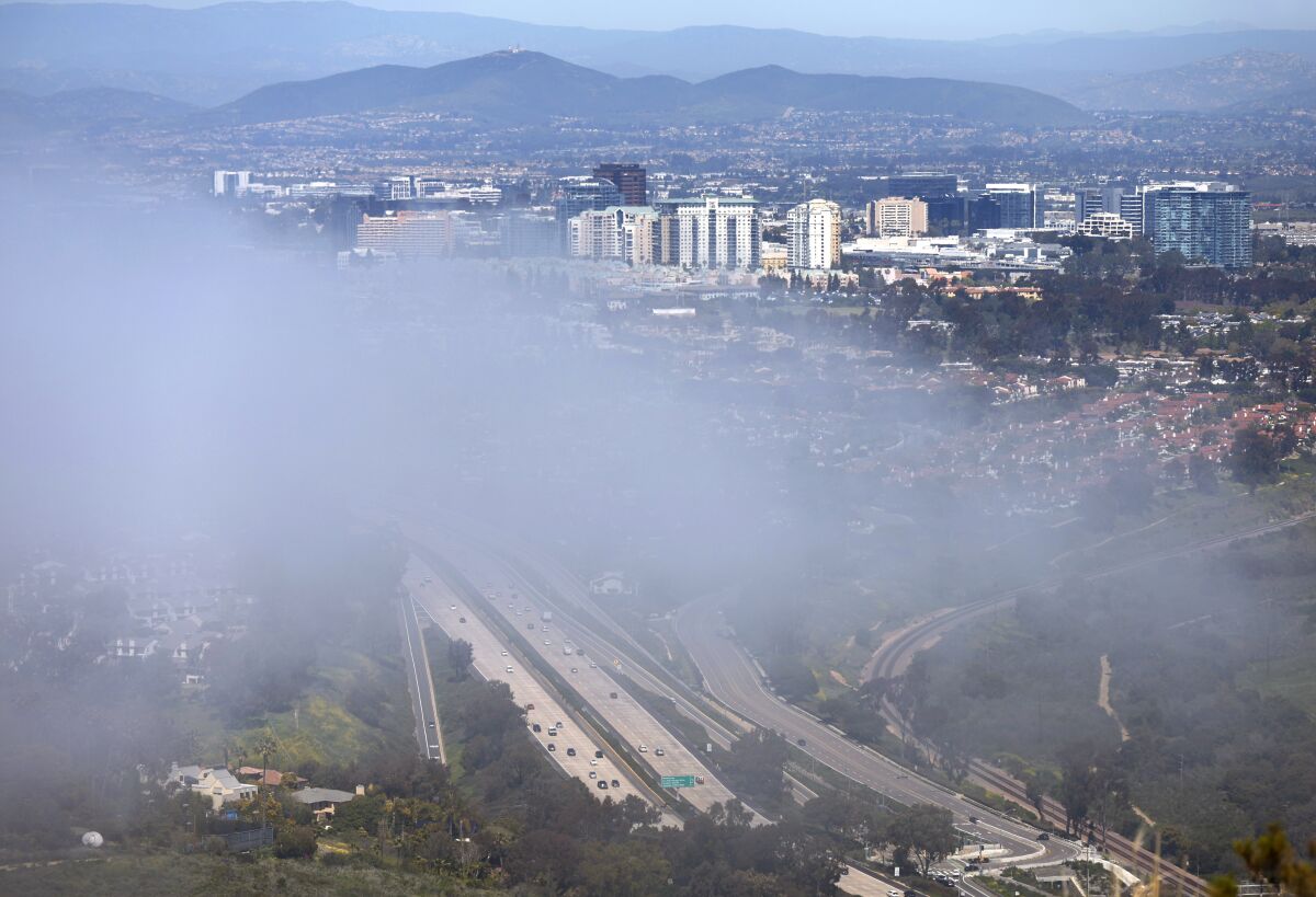 Fog envelops La Jolla and University City along Interstate 5 in April.