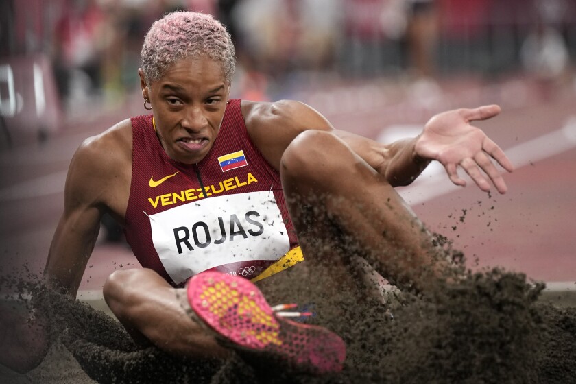 FILE - Yulimar Rojas, of Venezuela, competes in the qualification rounds of the women's triple jump at the 2020 Summer Olympics, July 30, 2021, in Tokyo. Olympic triple jump champion Yulimar Rojas cannot compete in long jump at the world championships in Oregon in July 2022 because her qualifying leap was done in unapproved shoes. (AP Photo/David J. Phillip, File)