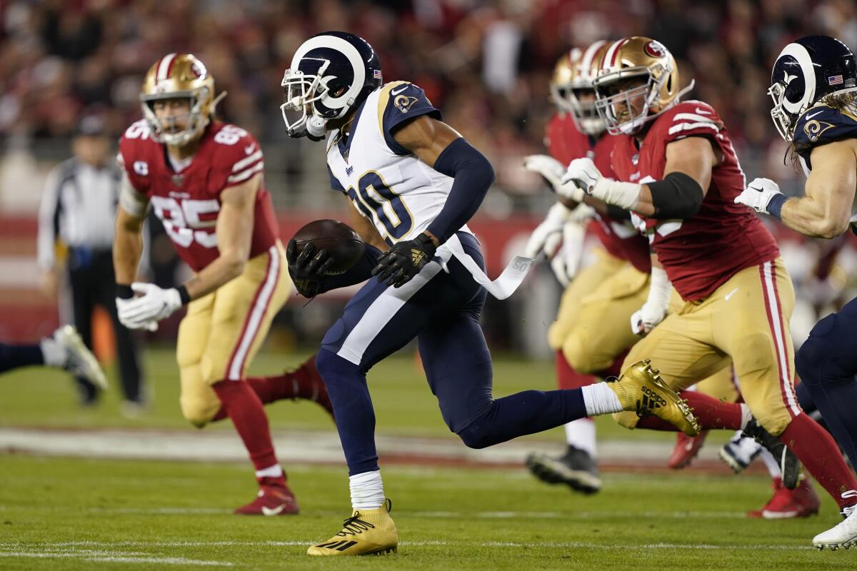 Rams cornerback Jalen Ramsey runs back an interception against the San Francisco 49ers in 2019.