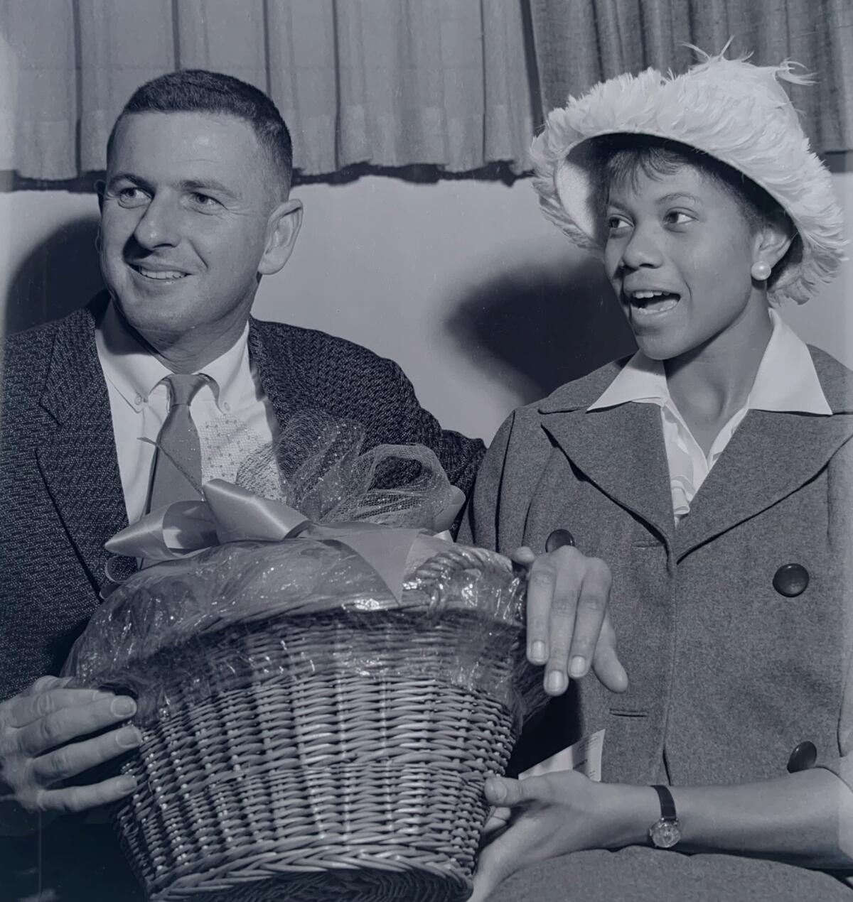 Al Franken, left, sits next to U.S. Olympic track and field champion Wilma Rudolph in an undated photo.