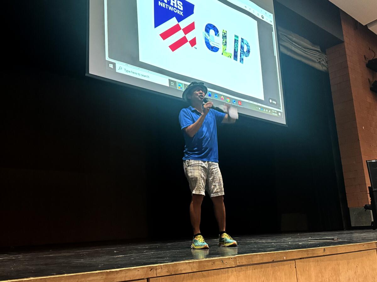 City Section flag football rules interpreter Nelson Bae explaining new rules to coaches