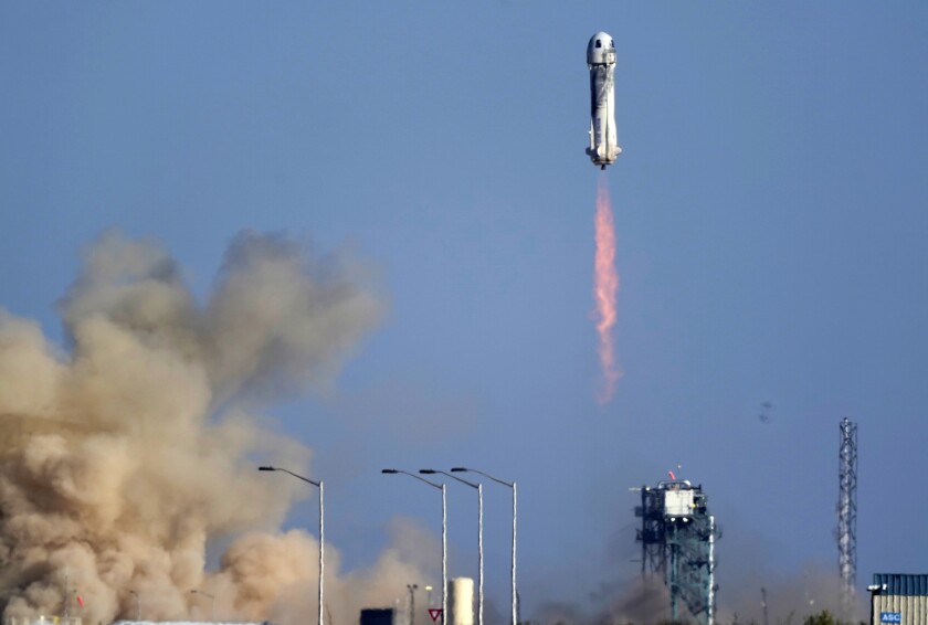 Blue Origin's New Shepard rocket lifts off.