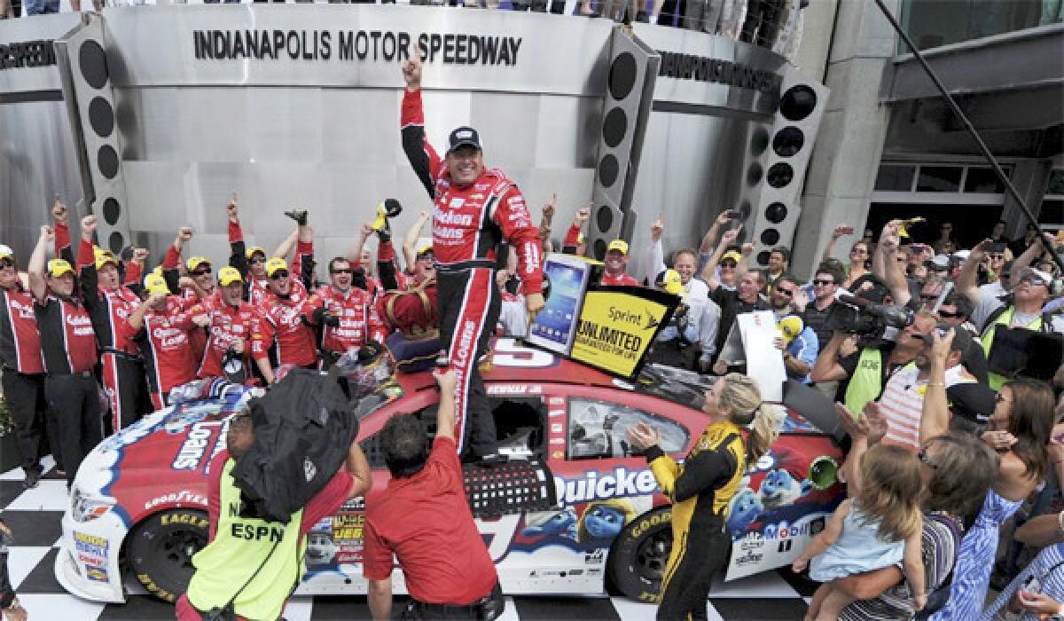 NASCAR Sprint Cup Series driver Ryan Newman celebrates after winning the Brickyard 400 auto race at the Indianapolis Motor Speedway on Sunday.