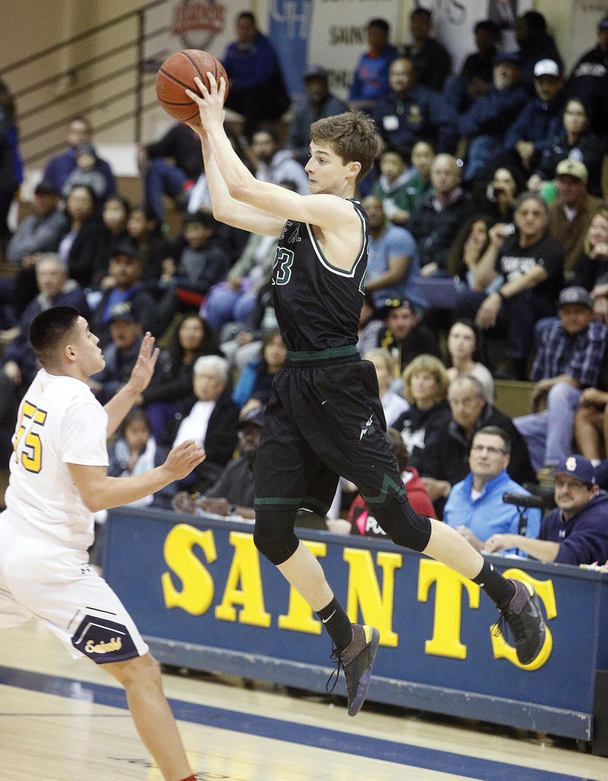 Sage Hill School's Jack Strohman jumps to catch a pass while bringing the ball up court in the quarterfinals of the CIF State Southern California Regional Division V playoffs at Santa Clara on Thursday.