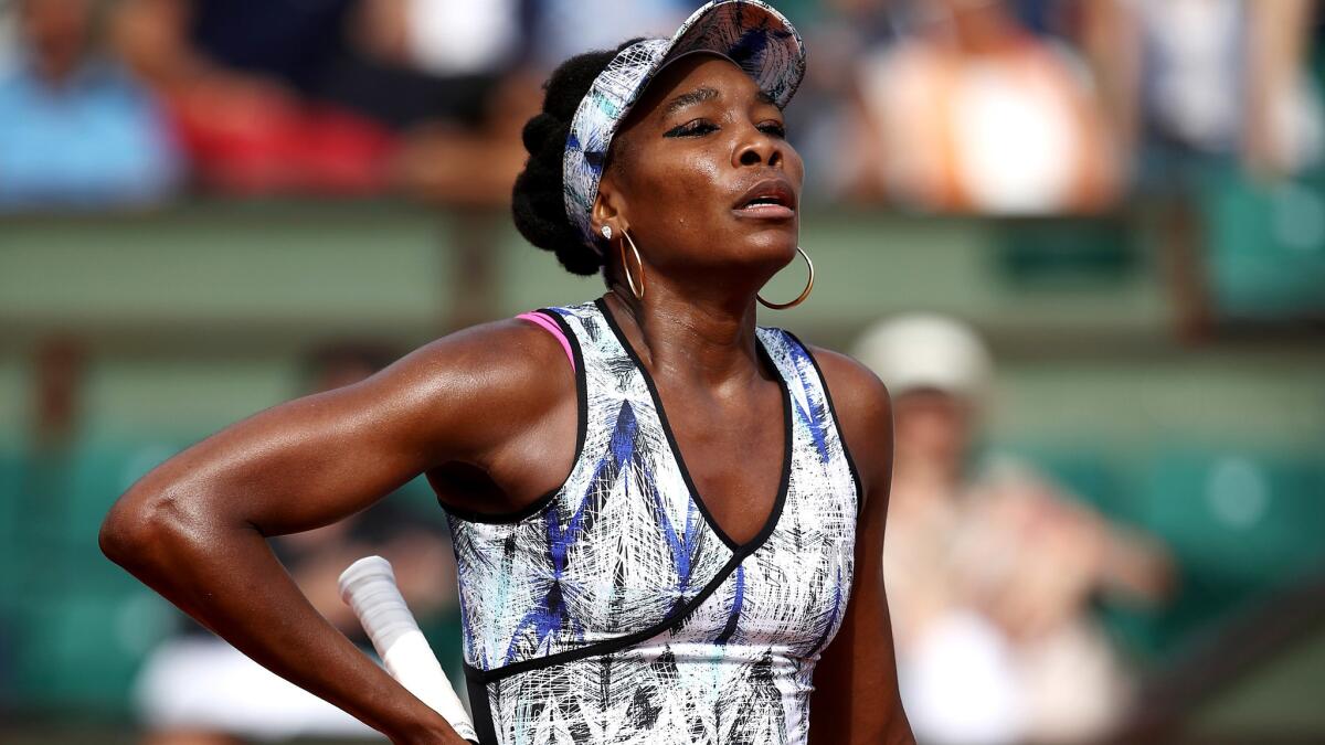 Venus Williams reacts after losing a point to Timea Bacsinszky at the French Open on Sunday.