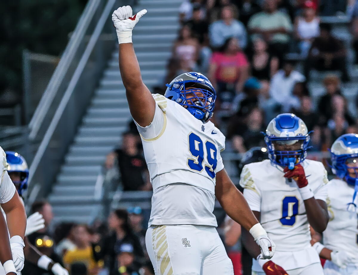 Sophomore Kingston Jimmerson of Santa Margarita High raises his right fist as he celebrates after a sack Friday night.