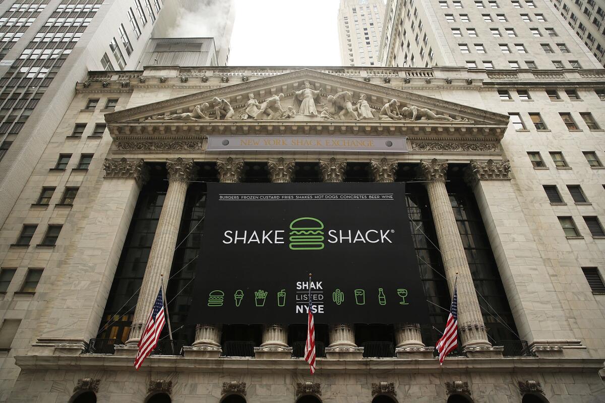 Star of the stock market, for the moment: A Shake Shack banner hangs on the New York Stock Exchange, marking the burger company's IPO on Friday.
