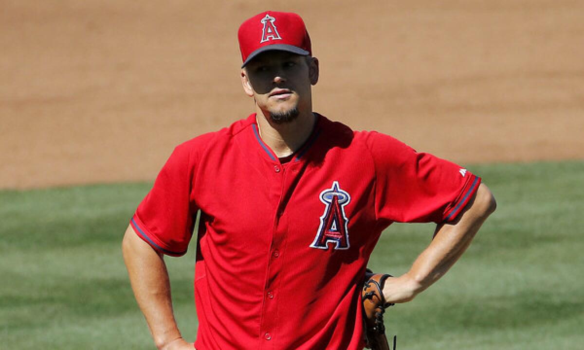 Angels pitcher Joe Blanton looks on after walking a batter during an exhibition game against the Chicago Cubs on Monday. Blanton had another shaky outing Saturday against the Milwaukee Brewers.