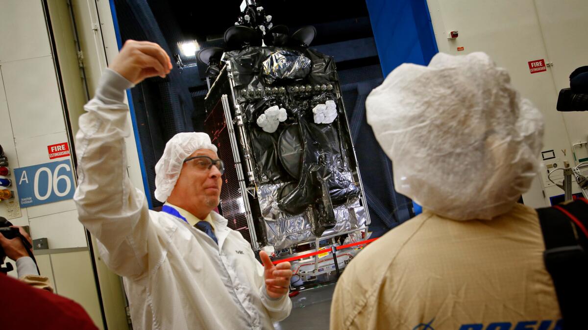 The first all-electric propulsion geostationary satellites are unveiled at Boeing Satellite Development Center in El Segundo in January 2015.