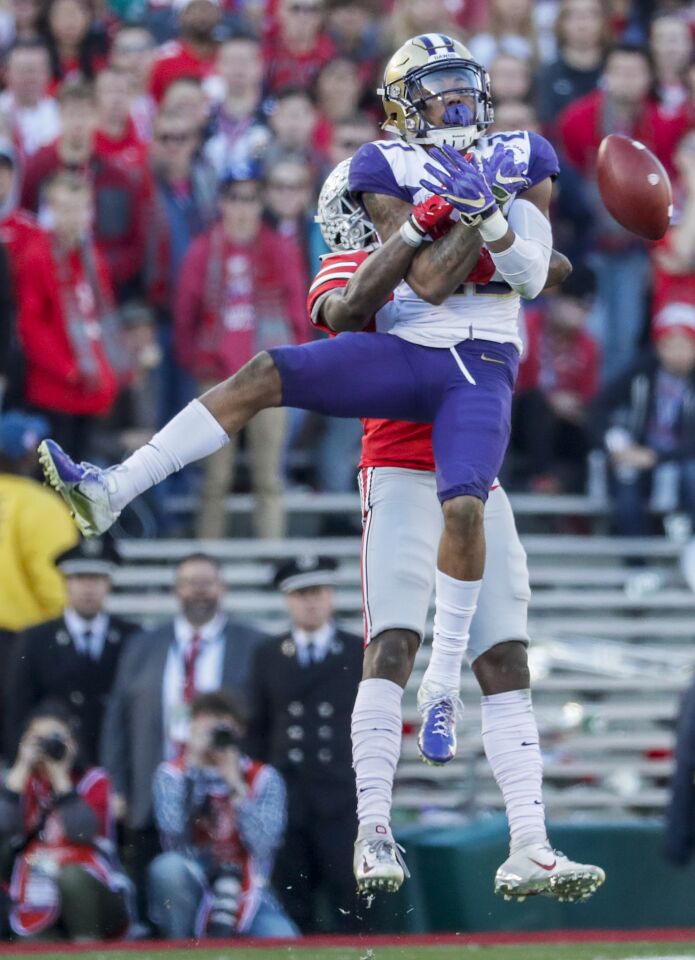 Washington defensive back Jordan Miller can’t make the interception as he steps in front of a pass intended for Ohio State receiver Terry McLaurin during the second half on Jan. 1.