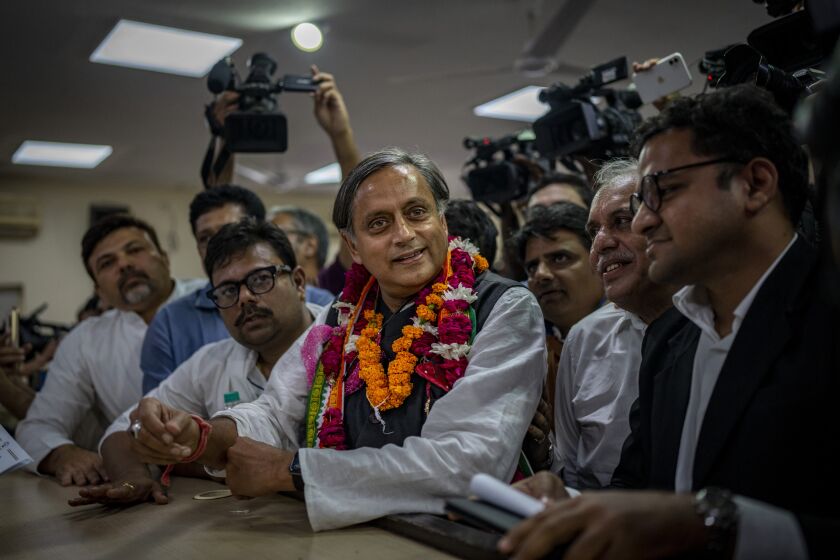 Senior Congress party leader Shashi Tharoor files his nomination papers for the position of Congress party president, at the party's headquarter in New Delhi, India, Friday, Sept. 30, 2022. India’s main opposition Congress party, long led by the politically powerful Nehru-Gandhi family, is set to choose a non-family member as its next president after a gap of more than two decades. (AP Photo/Altaf Qadri)