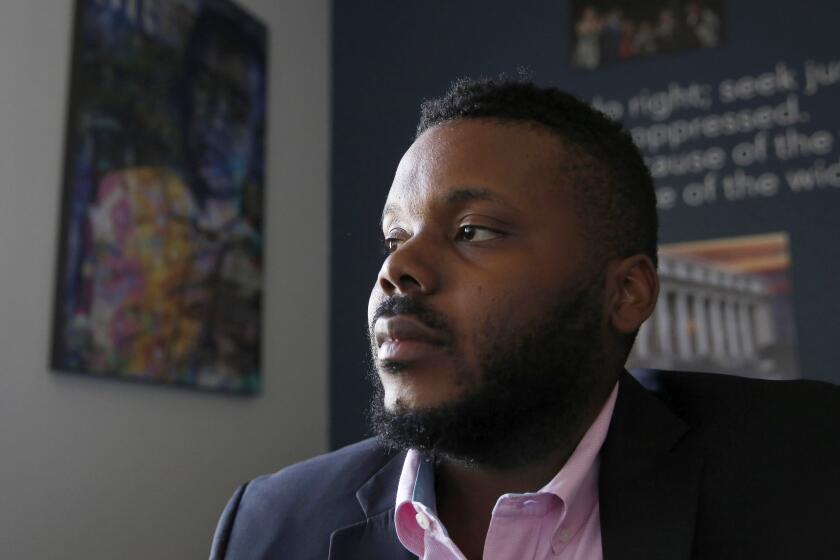 FILE - In this Aug. 14, 2019, file photo, then-Stockton, Calif., Mayor Michael Tubbs pauses during an interview in Stockton, Calif. The former mayor in California who gained international attention for running a guaranteed income program is joining Gov. Gavin Newsom's administration. Newsom named former Stockton Mayor Tubbs a special advisor for economic mobility and opportunity on Thursday, March 11, 2021. (AP Photo/Rich Pedroncelli, File)