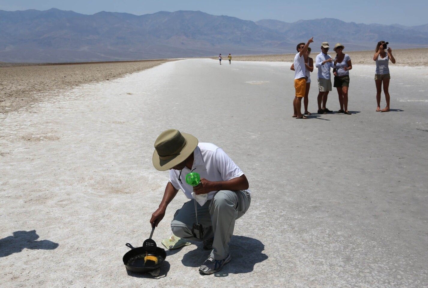 Randy Thomas of Vacaville, Calif., tries to fry an egg on the salt flats in Death Valley's Badwater Basin. He drove there to experience the heat.