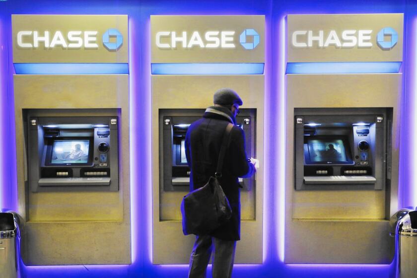 The addition of cardless ATMs comes as banks are trying to push customers to do more transactions online, on their phones or through ATMs. Above, at a branch last year in New York.
