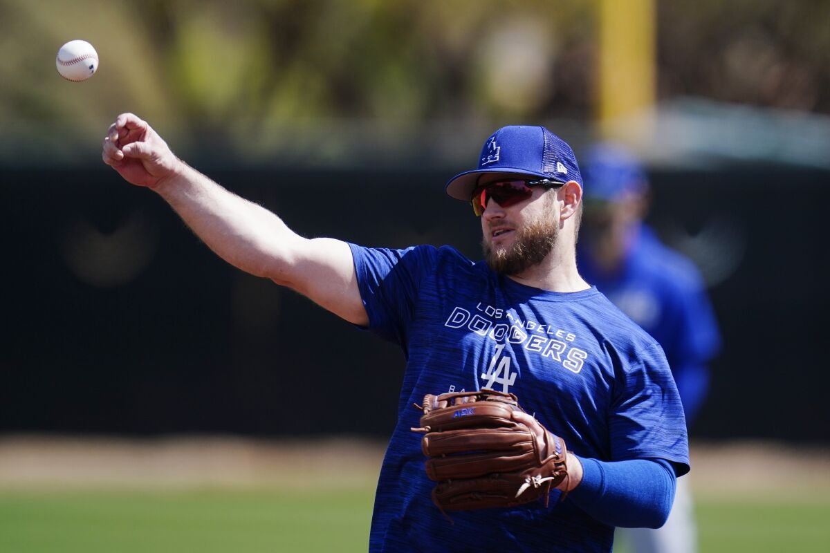Dodgers infielder Max Muncy warms up during a spring training workout.