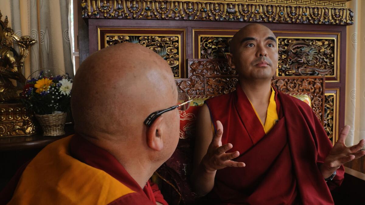 Two Buddhist monks in the documentary “Aware: Glimpses of Consciousness.”