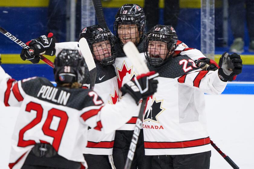 The players of Canada celebrate after Brianne Jenner has scored their second goal.