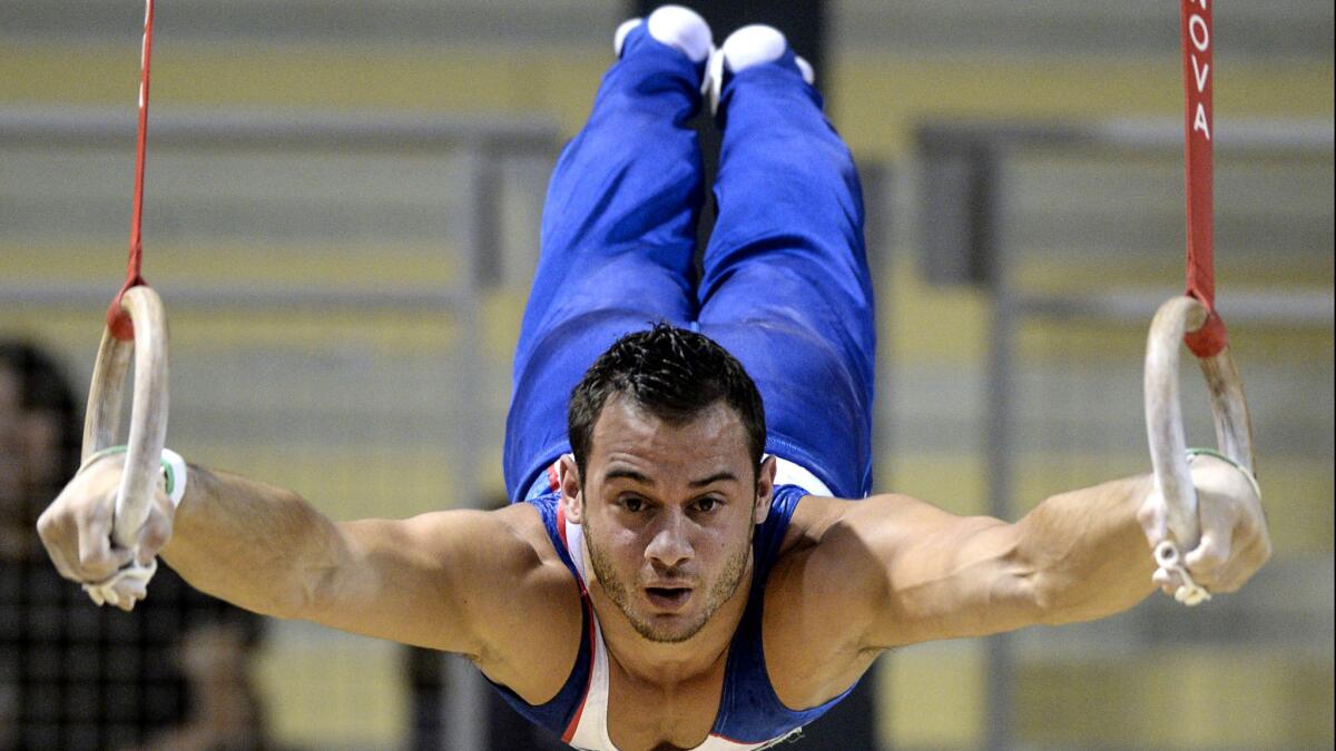Samir Ait Said performs on the rings during the French national championships earlier this year.