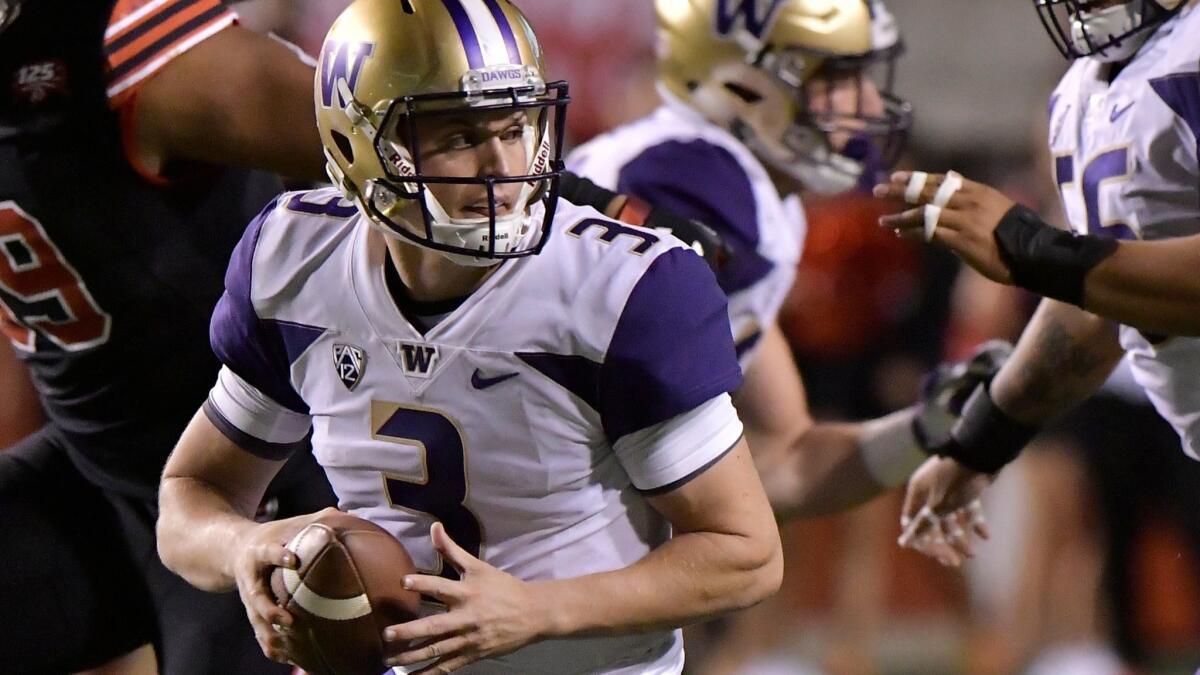 Washington quarterback Jake Browning looks to pass the ball in the first half against Utah at Rice-Eccles Stadium on Saturday in Salt Lake City.