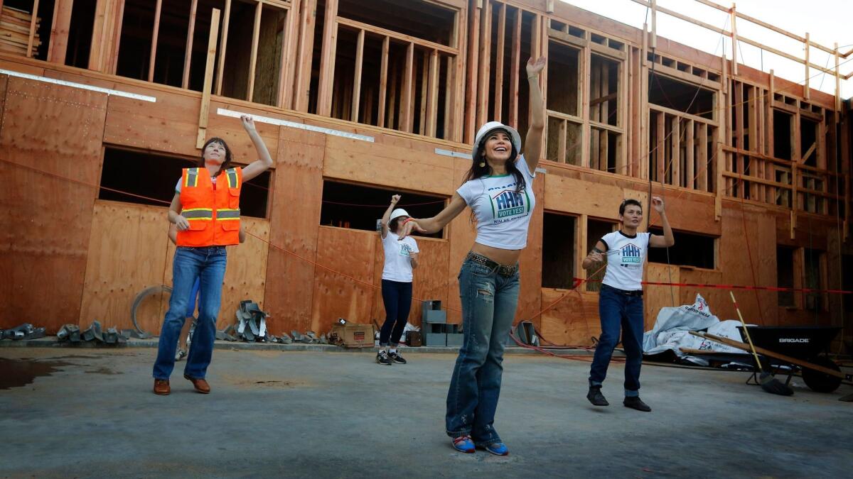 Fransini Giraldo, center, leads performers during a video shoot last week in support of Proposition HHH, the homeless housing construction bond on Tuesday's ballot.