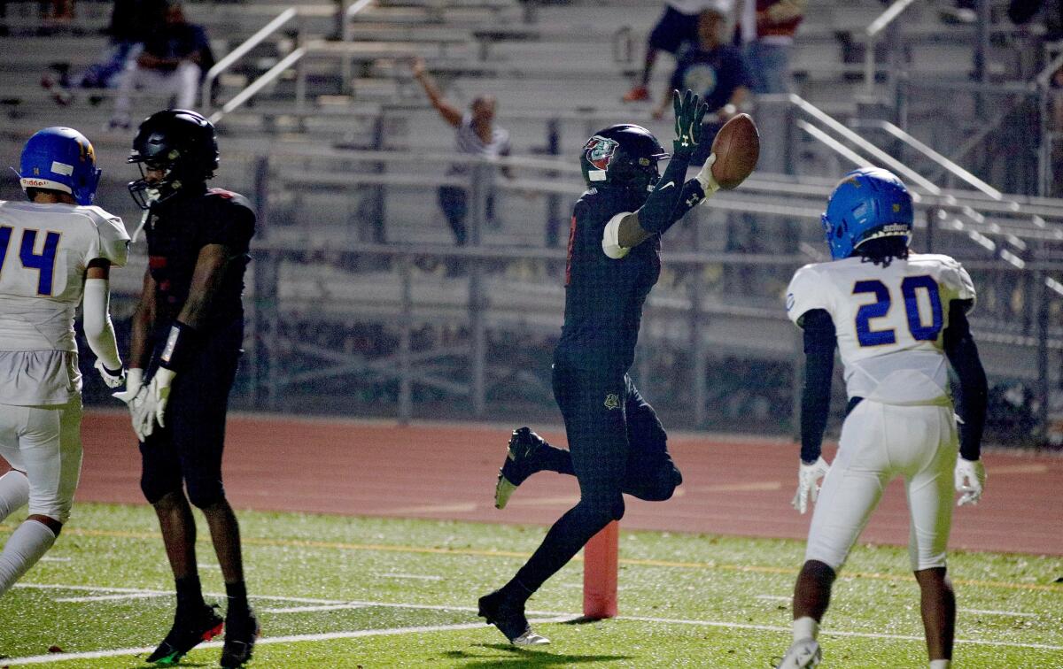 Bryant Collins of Dymally scores one of his four touchdowns in a win over Crenshaw on Friday.