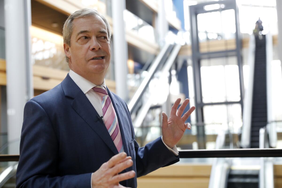 Britain's Nigel Farage, the leader of the Brexit Party, answers reporters at the European Parliament on Jan. 14, 2020, in Strasbourg, France.