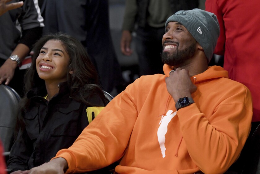 Kobe Bryant and his daughter Gianna attend a game between the Lakers and Dallas Mavericks on Dec. 29, 2019.