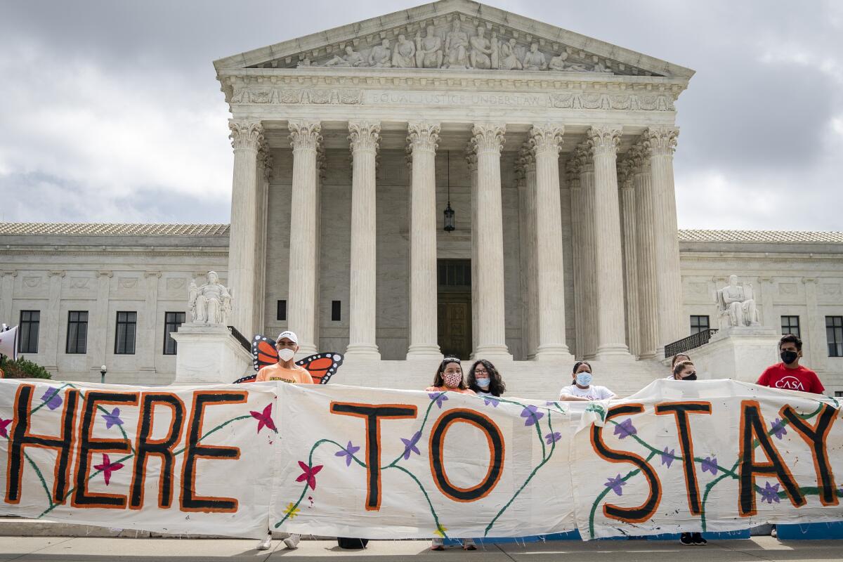 DACA recipients and their supporters rally outside the Supreme Court on Thursday in Washington.