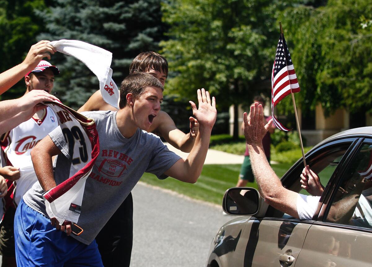 Fans in Cleveland react to the news that LeBron James is returning.