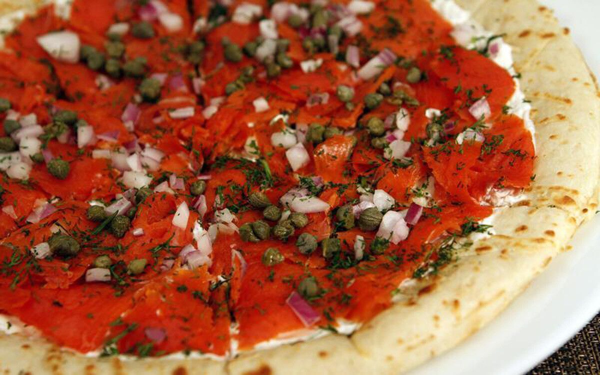 Top a prepared pizza crust with a little sour cream and smoked salmon, along with chopped red onion, fresh dill and capers. Recipe: Smoked salmon pizza