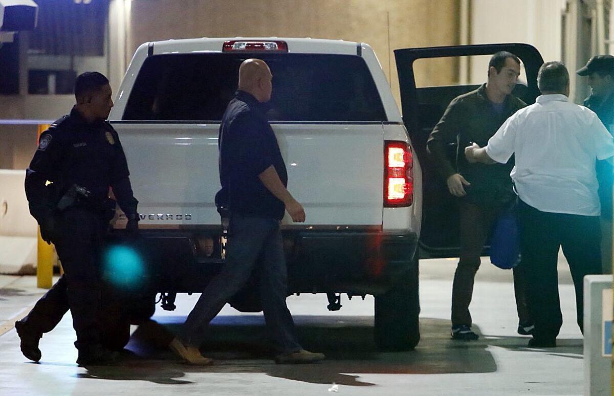 Former U.S. Marine Andrew Tahmooressi is released from Mexican custody Friday. Here Tahmooressi gets out of a pickup truck at the border to go through U.S. Customs into the United States. U-T San Diego photo by Alejandro Tamayo