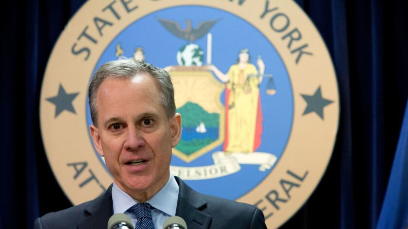 New York Atty. Gen. Eric Schneiderman speaks during a news conference in New York. Schneiderman has sued Weinstein Co. and brothers Harvey and Bob Weinstein in a move that could derail plans to sell the troubled studio.