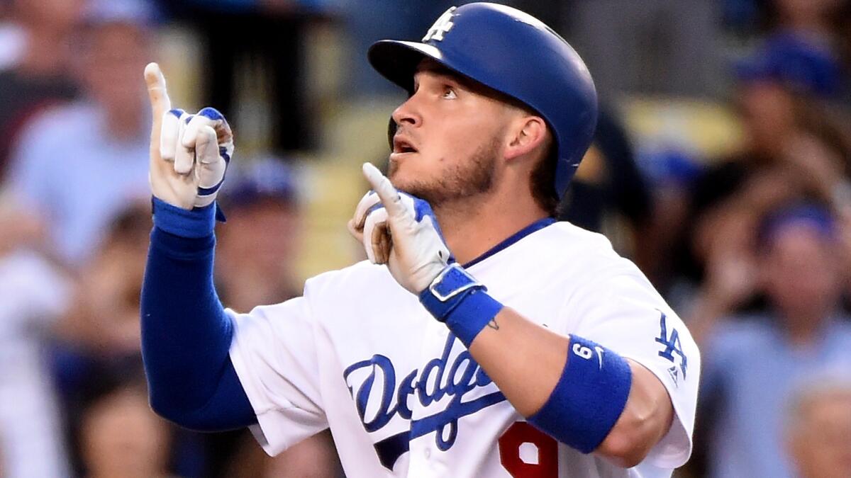 Dodgers catcher Yasmani Grandal celebrates after hitting a home run against the Diamondbacks on Sept. 5.