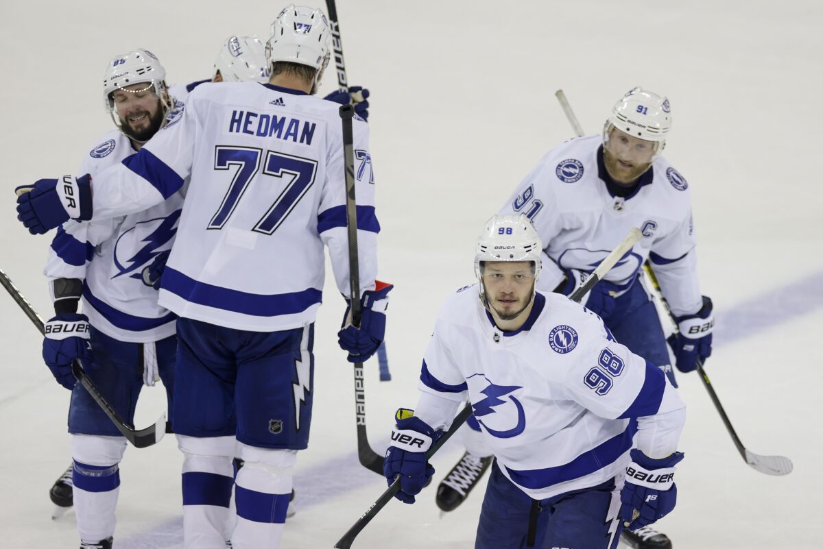 Tampa Bay Lightning defenseman Mikhail Sergachev (98) heads to the bench after scoring a goal against the New York Rangers during the third period in Game 5 of the NHL Hockey Stanley Cup playoffs Eastern Conference Finals, Thursday, June 9, 2022, in New York (AP Photo/Adam Hunger)