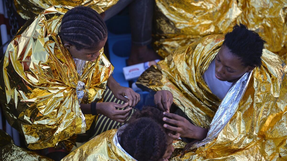 African women aboard the Topaz Responder after a rescue operation of migrants and refugees off the Libyan coast in the Mediterranean Sea in 2016. The arrive in the hundreds every month. Many of them are destined for years of sexual slavery. (ANDREAS SOLARO / AFP / Getty Images)