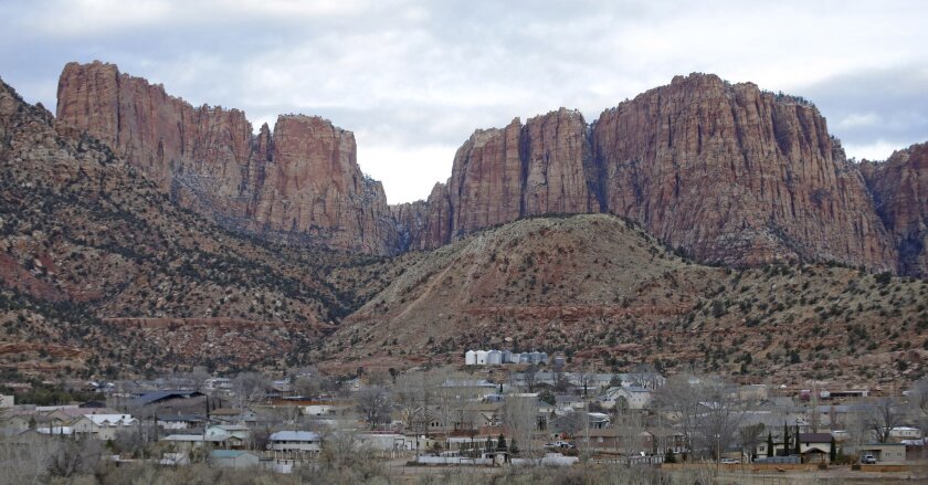 Hildale, Utah, sits at the base of Red Rock Cliff mountains, with its sister city, Colorado City, Ariz., in the foreground.