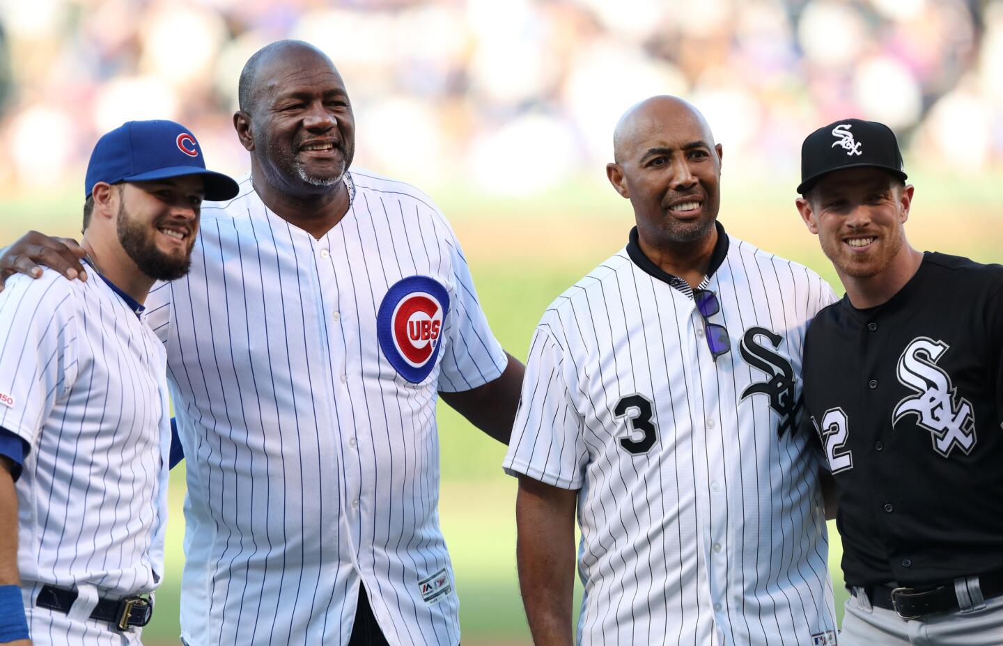 Former Cubs player Lee Smith and former Chicago White Sox player Harold Baines pose for photographs after both threw out ceremonial first pitches before a Cubs-White Sox game at Wrigley Field on June 18, 2019.