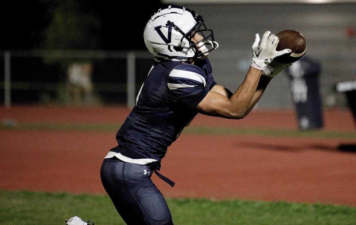 Venice High receiver Amir Smith makes a fingertip catch in the end zone.