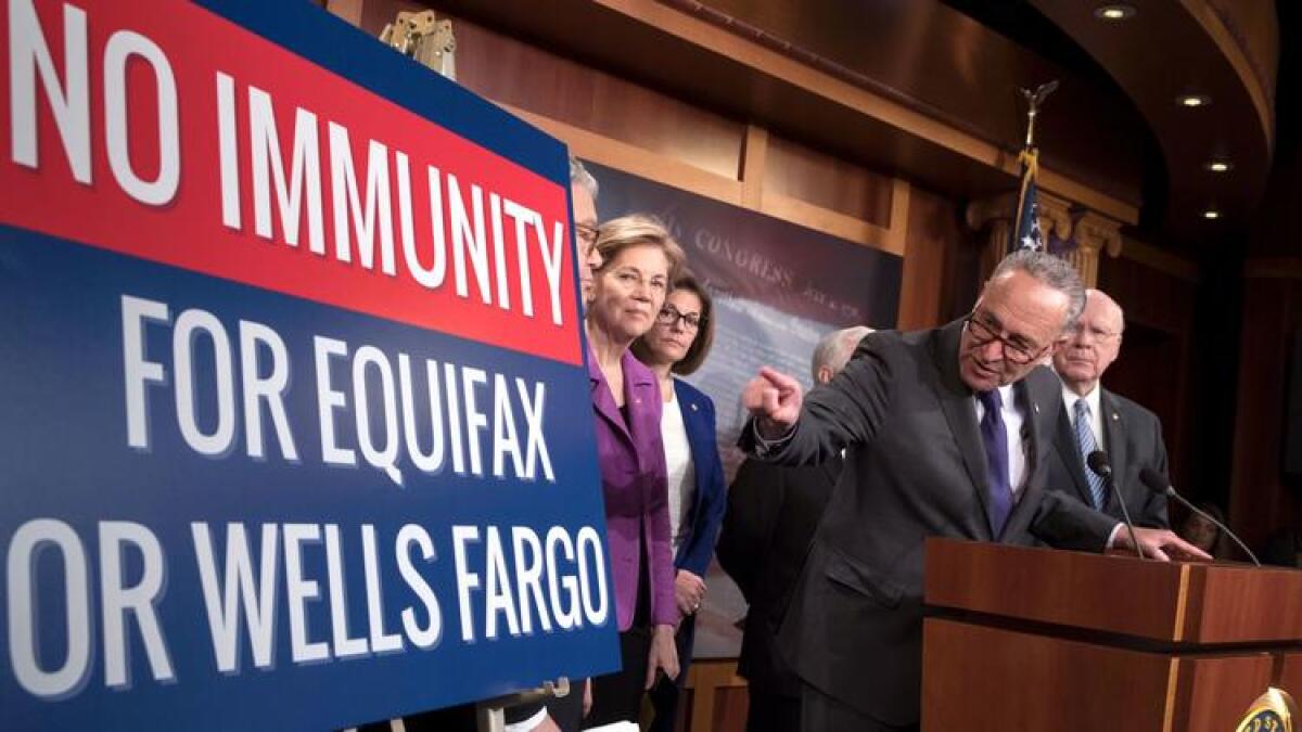 Senate Minority Leader Charles E. Schumer (D-N.Y.), center, and other Democrats discuss the federal arbitration rule.