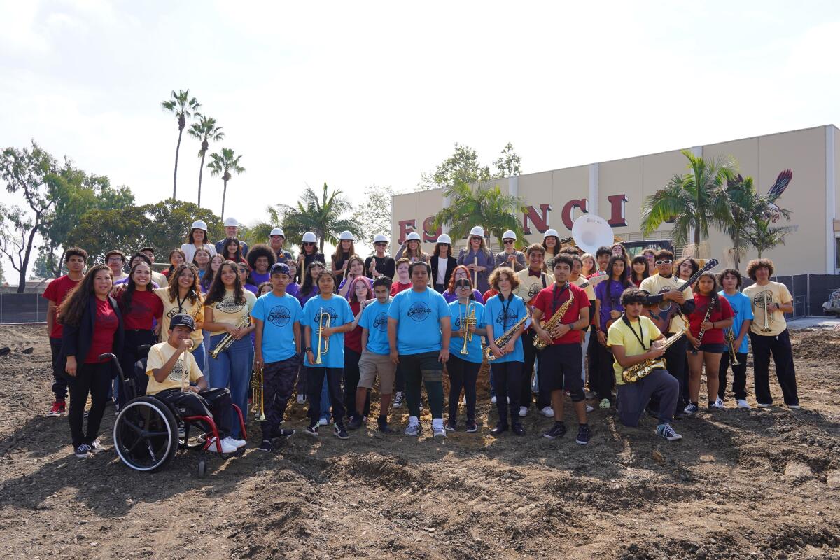 Estancia High School students join NMUSD officials and administrators Friday to celebrate construction of a new theater.