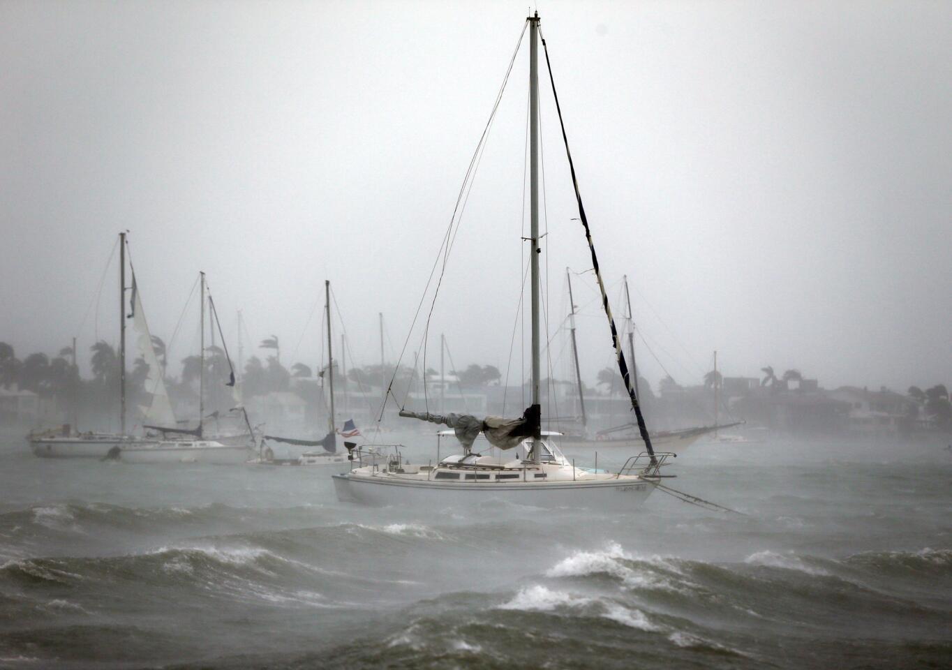 Sailboats moored near Watson Island ride out the winds and waves as Hurricane Irma passes by on Sept. 10, 2017, in Miami Beach, Fla.