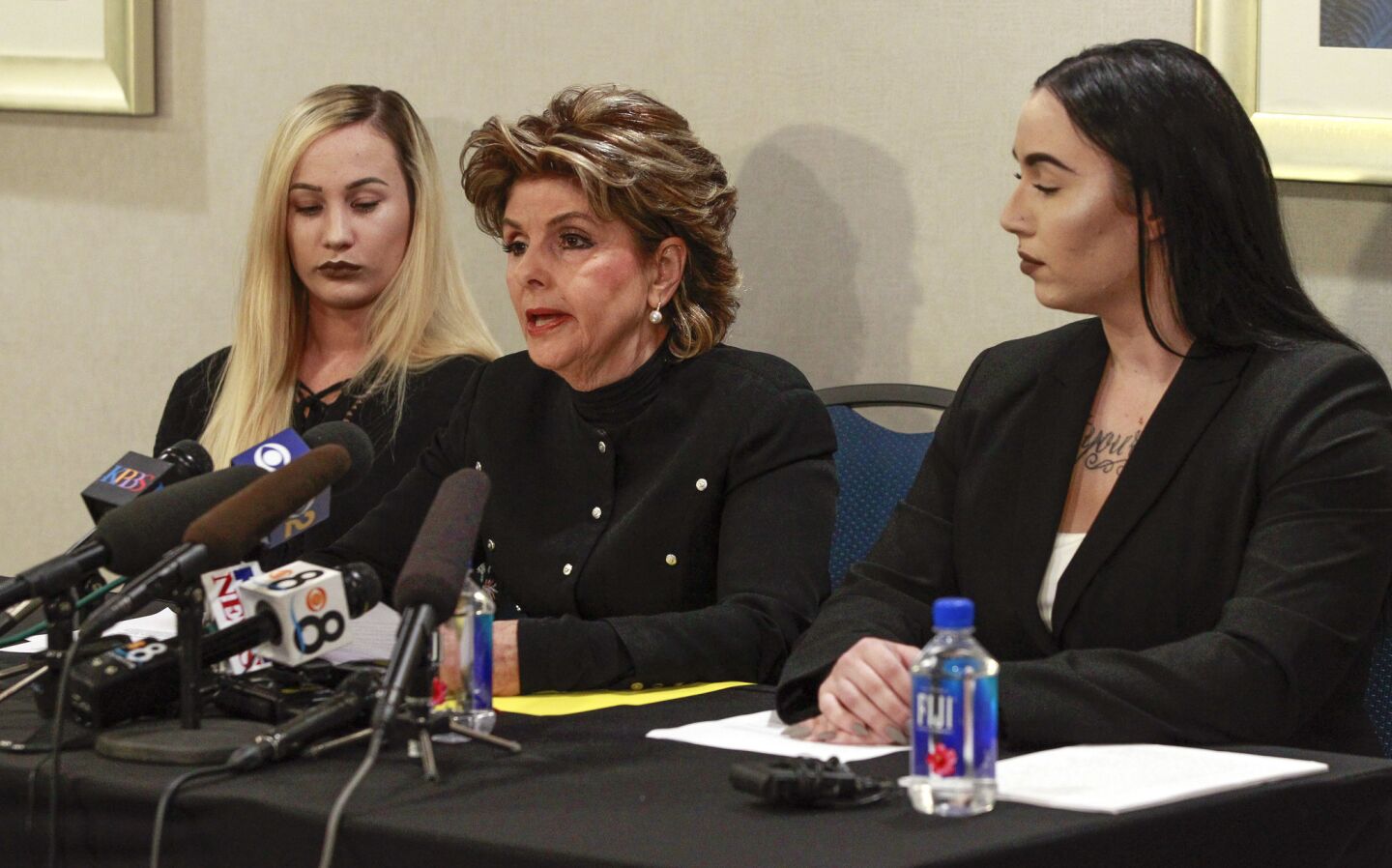 Attorney Gloria Allred, center, former Marine Erika Butner, right, and active duty Marine Lance Cpl. Marisa Woytek, both victims of the Marines United scandal, hold a news conference at the Holiday Inn Oceanside Marina in Oceanside on Thursday.