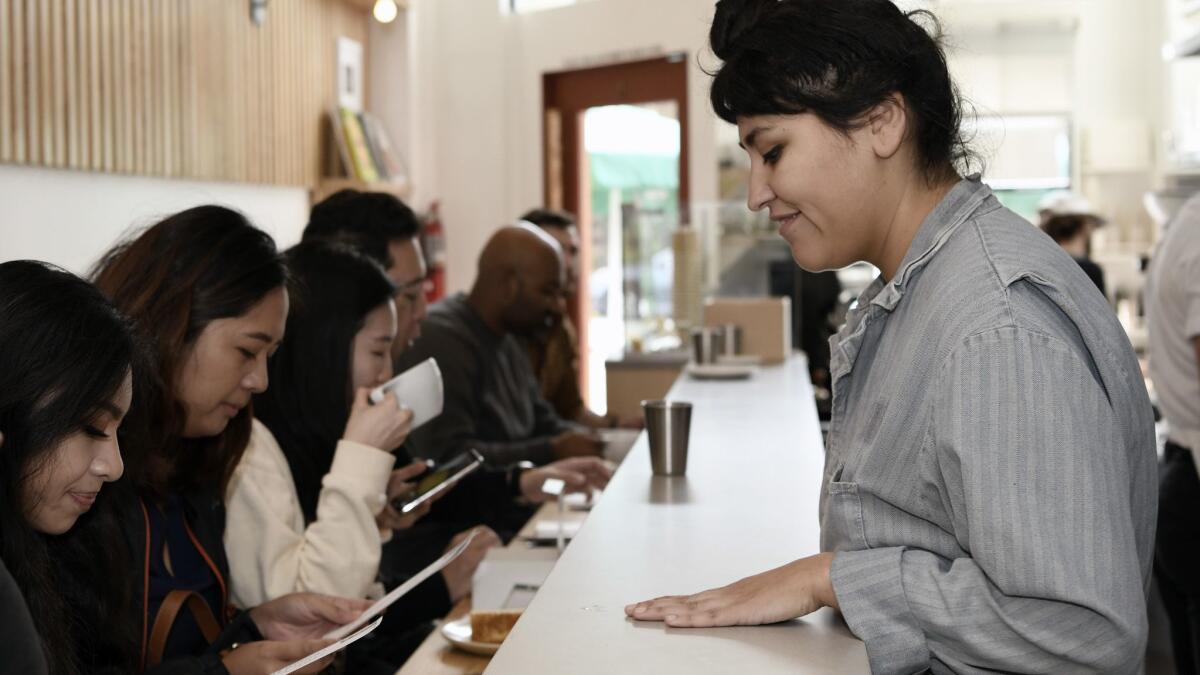 Employee Jacqueline Vaca tends to customers at Konbi's 10-seat counter.