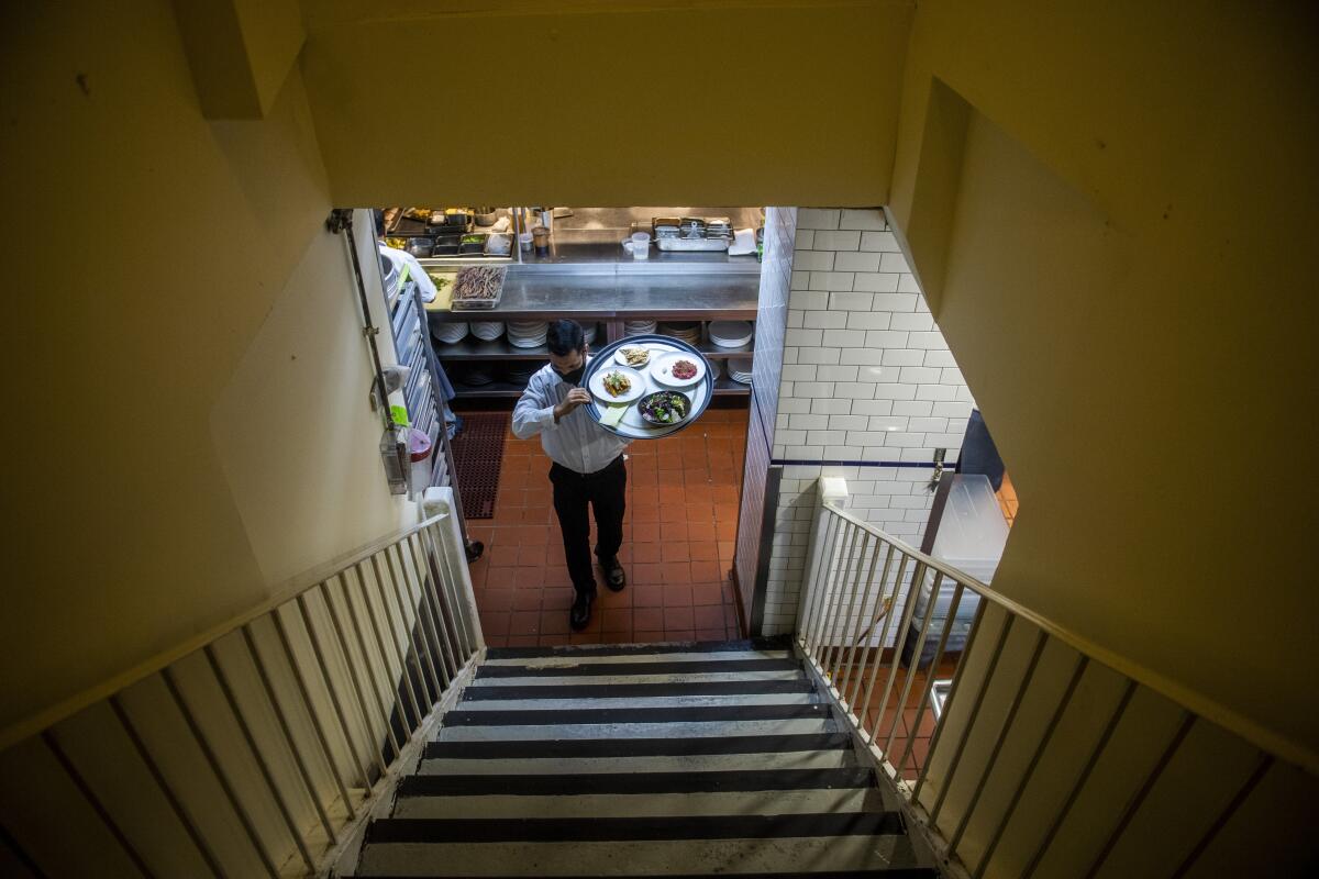 Muhammad Rahman delivers orders at a New York restaurant.