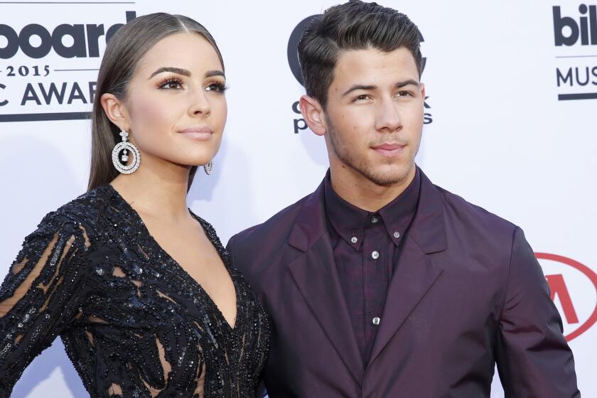 Olivia Culpo and Nick Jonas on the red carpet at the 2015 Billboard Music Awards in May.