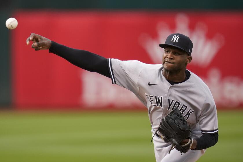 New York Yankees pitcher Domingo Germán throws to a Oakland Athletics batter during the first inning of a baseball game in Oakland, Calif., Wednesday, June 28, 2023. (AP Photo/Godofredo A. Vásquez)